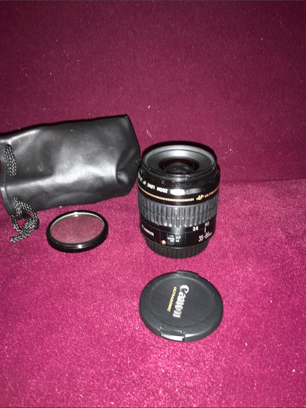 Canon EF 35-80mm F/4-5.6 Lens with lens covers & pouch. Good working condition.